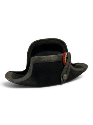 a black hat that has a red tag on it