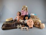 a lot of dolls that are sitting on a table