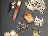 many different types of jewelry on a table