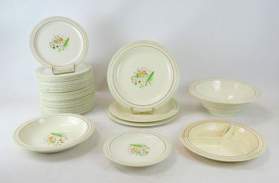 many plates and bowls that are sitting on a table