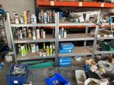 many different types of paint and tools in this garage