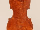 an old violin with a wooden back and a long neck