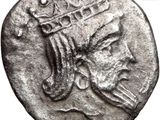 a silver coin with a crown on top of it