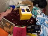 a pile of various items that are on a bed