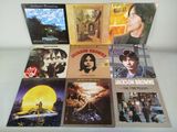a lot of different album covers on the table