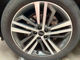 a close up of a tire on a car ' s rim