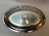 a silver plate with a label on it on a table