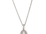 a close up of a necklace on a white background