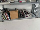 many books on the shelves in the room