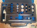 a tool set in a case on a table