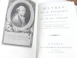 an open book with a picture of a man on it