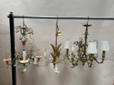 a lot of chandeliers that are hanging on the wall