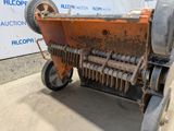 a machine that is sitting on the side of the road
