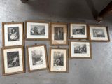 many framed pictures on the floor of this room