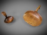 two wooden spoons and a wooden spoon on a gray surface