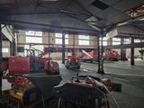 a large garage with a lot of machinery in it