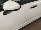a white car that is parked in a garage