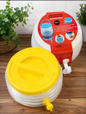 a plastic container with a yellow lid sitting on a wooden table