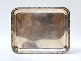 an antique silver plate with a square design on it