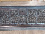 a wooden chest sitting on a hard wood floor