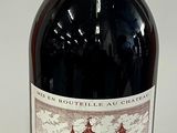 a bottle of wine that is sitting on a table