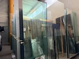 many glass doors in a building that are being built