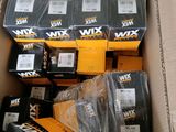 many boxes of batteries in a cardboard box on the floor