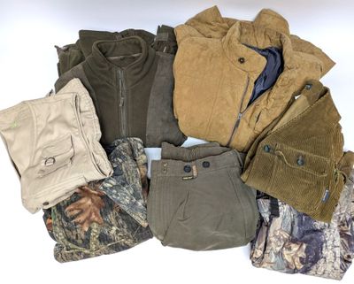 a lot of men ' s clothing on a white surface