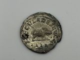 a silver coin with a picture of a horse on it