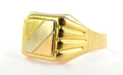 yellow gold ring with a diagonal design on the front of the ring