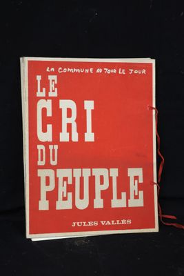 a red book with white writing on it on a black background
