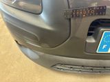 a sticker on the bumper of a car with a sticker on it
