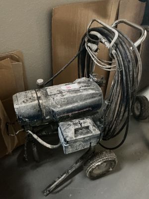 a machine that is sitting on the floor next to a toilet