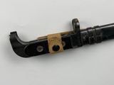 a small black knife with a brown handle on a white surface