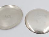 an antique silver plate with a silver lid and a silver plate with a silver plate on top of it