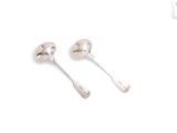 pair of silver spoons with handles on white background
