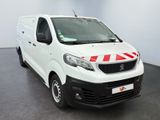 the white van is parked in a large room with a red and white stripe on the side