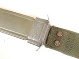 a close up of a knife with a metal handle