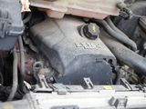 a close up view of a car engine with its hood open
