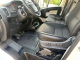 a view of the inside of a vehicle with the driver ' s seat up