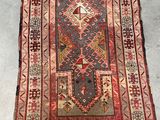 a rug with a red and blue design on it