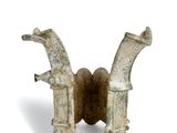 pair of old metal pipes on a white surface with a white background