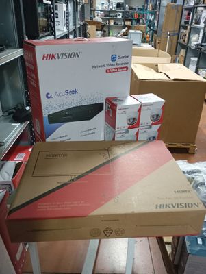 many boxes of electronics on a table in a store