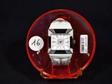 a watch that is sitting on top of a red object