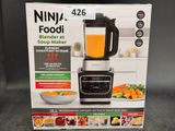 a box of ninja food blender sitting on a table