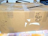 a cardboard box with a sticker on it sitting on a table