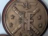 two coins with the letter f on them are sitting next to each other