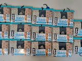 a lot of bags of cookies hanging on the wall