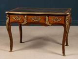 a small wooden table with a marble top on it