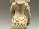 an image of a statue of an elephant with a head on it ' s back